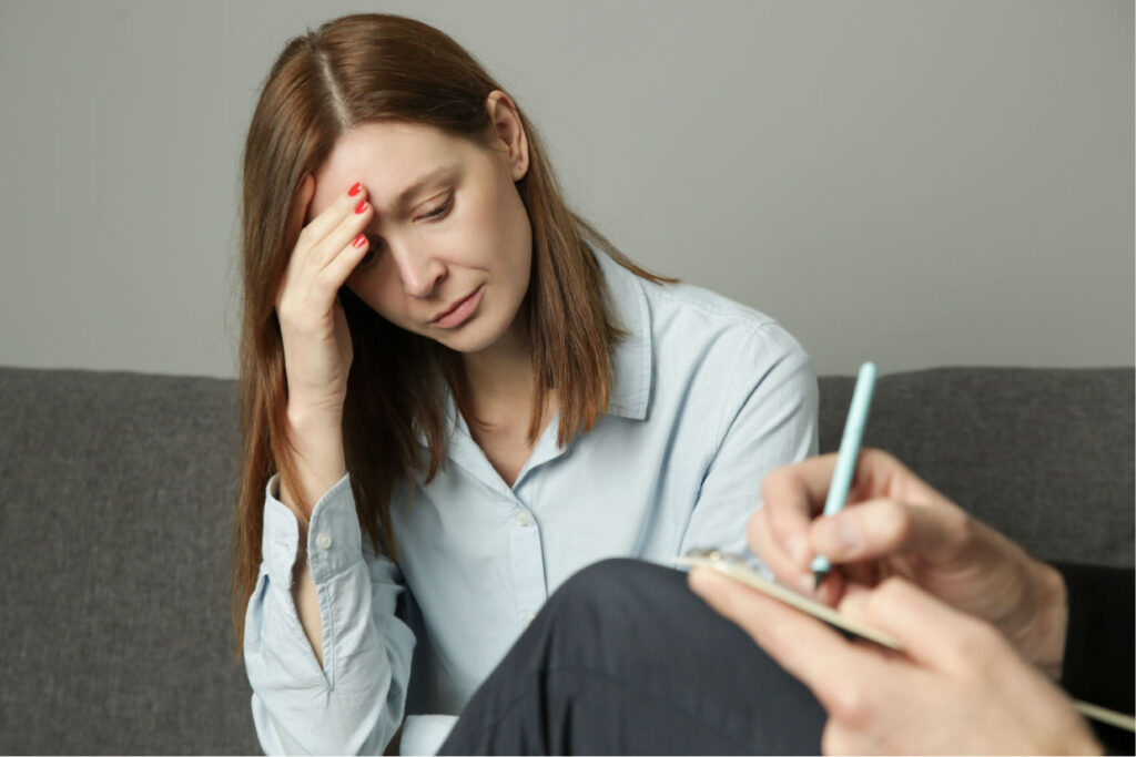 woman speaking with counselor at womens substance abuse treatment center