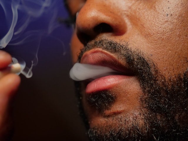 Close-up of a man smoking.