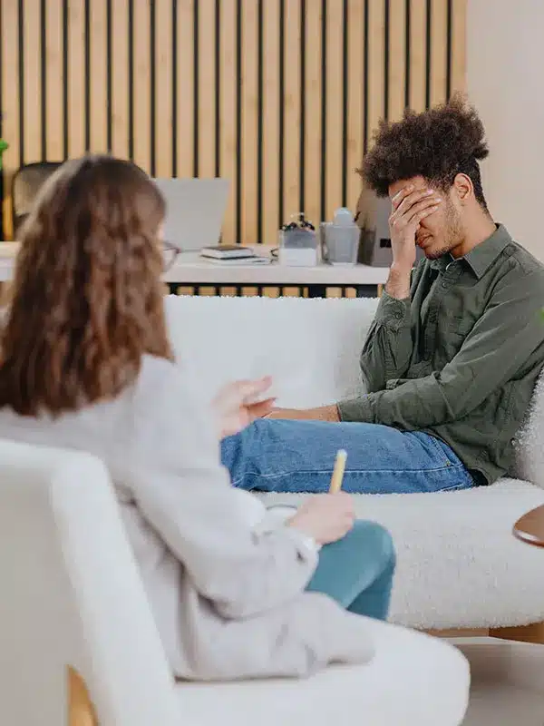 a therapy session attending by an adult